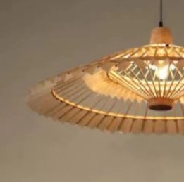 Large fan shaped wall sconce hand woven in natural rattan
