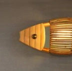 Fish shaped wall sconce hand woven in natural rattan