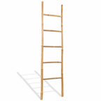Five rung natural bamboo blanket ladder leaning against a wall