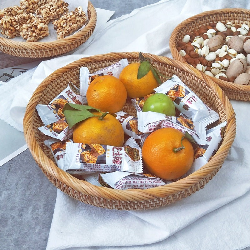 Flat round rattan basket holding nuts