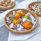Flat round rattan basket holding nuts
