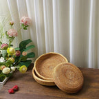 Flat round rattan basket holding nuts