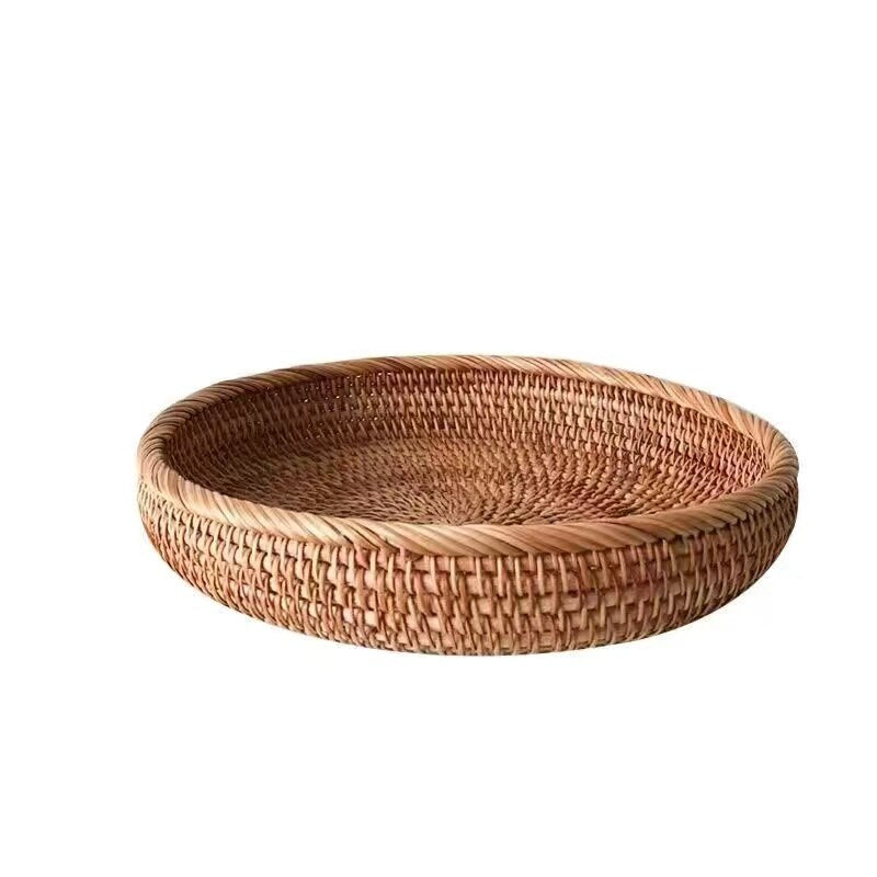 Flat round rattan basket holding nuts