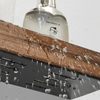 Slim floating wood ledge shelf with aluminum rail holding toiletries