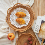 Flower shaped rattan fruit bowls holding oranges and bananas