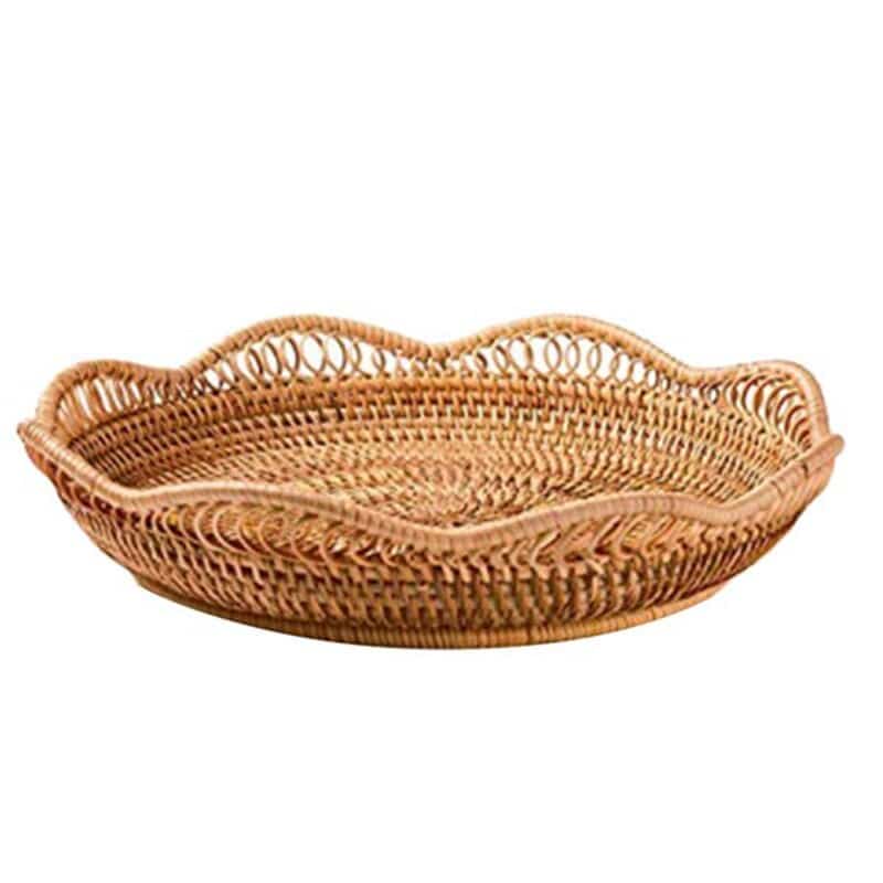 Flower shaped rattan fruit bowls holding oranges and bananas