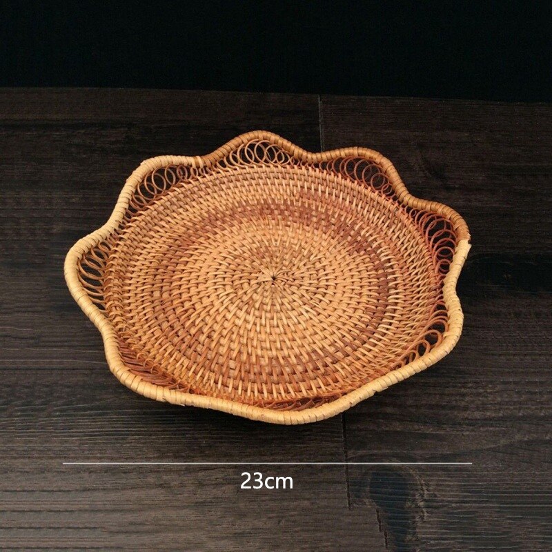 Flower shaped rattan fruit bowls holding oranges and bananas