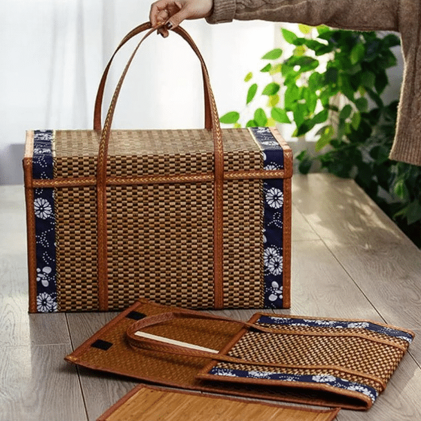 Suitcase style woven bamboo picnic basket with fabric trim and handles