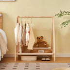 Folding modern clothes rack with a crossed light natural wood frame