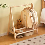 Folding modern clothes rack with a crossed light natural wood frame