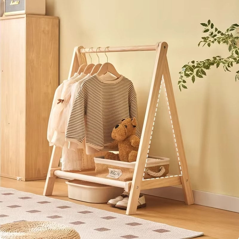 Folding modern clothes rack with a crossed light natural wood frame