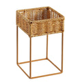 Small square hand woven rattan planter raised on legs
