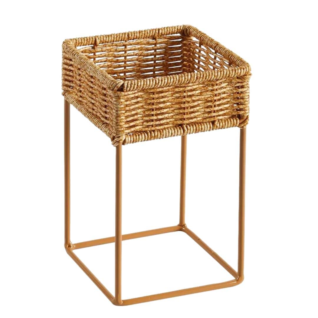Small square hand woven rattan planter raised on legs
