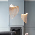 Sculptural futuristic pendant light made of finely cut natural wood slats