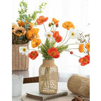 Glass vase in a woven rattan sleeve with a triangle pattern