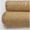 Roll of greenish rattan cane webbing with a round open mesh
