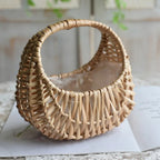 Small half moon shaped woven basket with handle