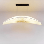 Long rounded pendant light hand knitted in golden straw look fiber on an iron frame