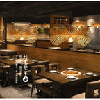 Spiral pendant light hand woven in natural bamboo and rattan