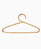 Clothes hanger wrapped in tightly hand woven natural rattan
