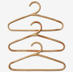 Clothes hanger wrapped in tightly hand woven natural rattan