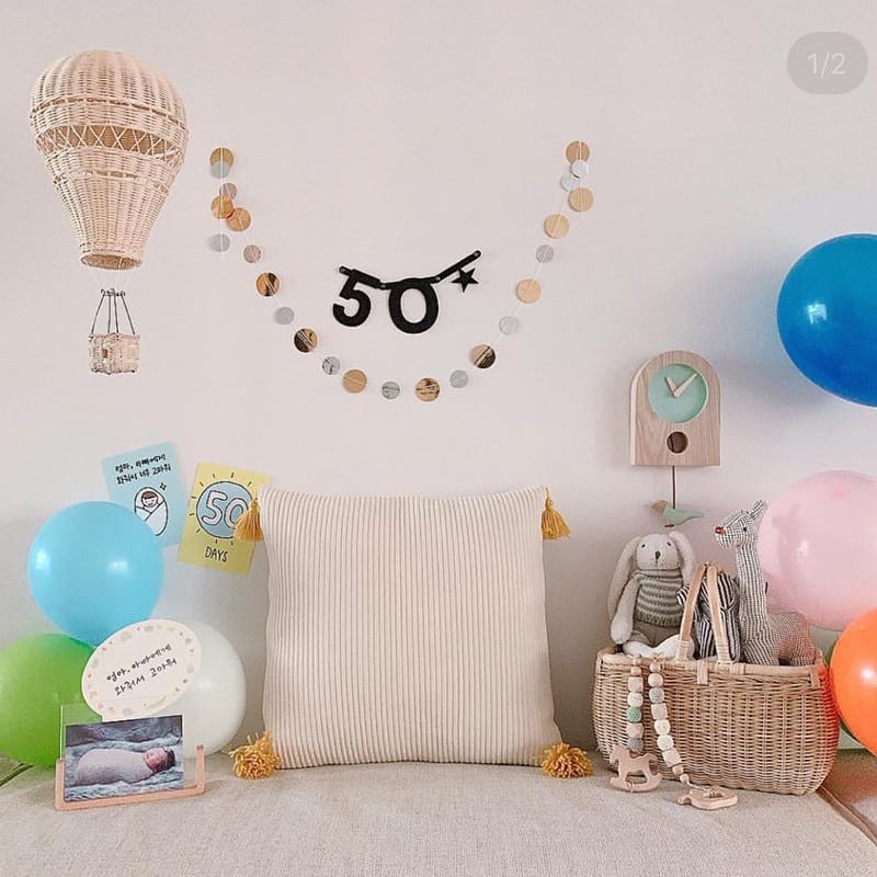 Hand woven beige rattan hot air balloon hanging decoration for a nursery