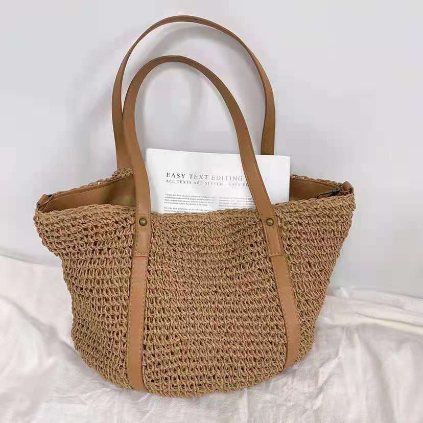 Hand woven straw handbag with a dense, even texture in brown or beige