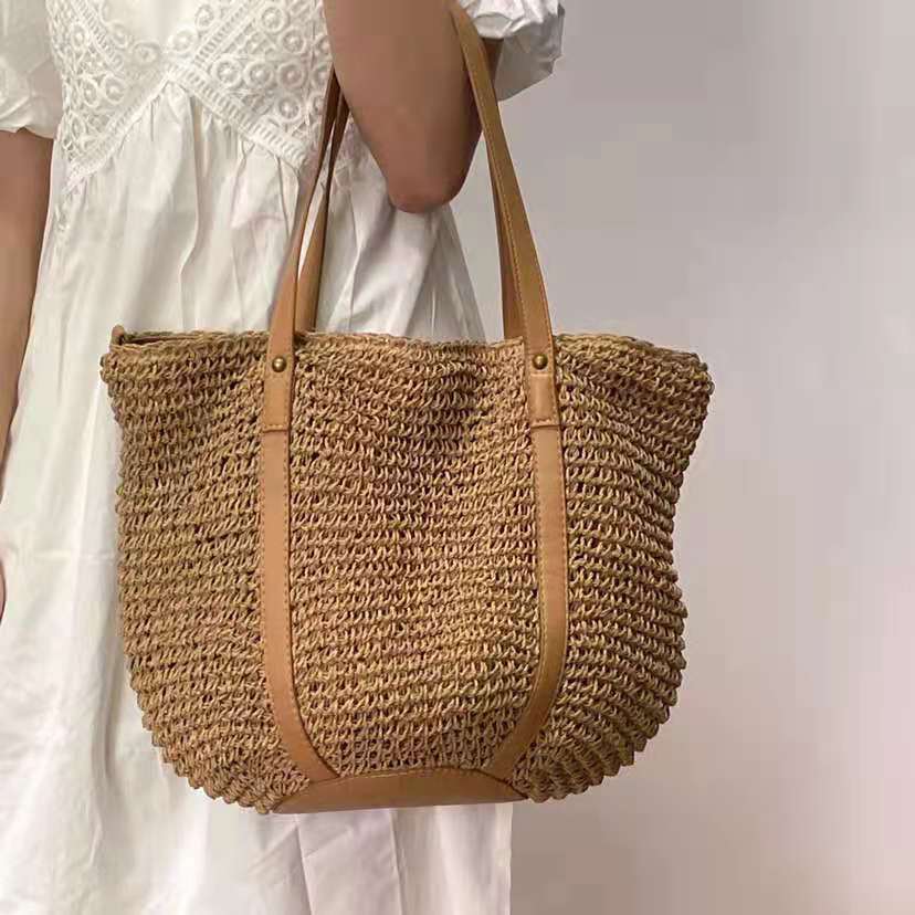 Hand woven straw handbag with a dense, even texture in brown or beige