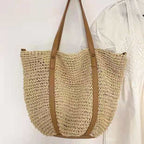 Hand woven straw handbag with a dense, even texture in brown or beige