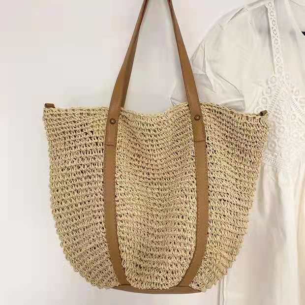 Hand woven straw handbag with a dense, even texture in brown or beige