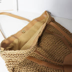 Hand woven straw handbag with a dense, even texture in brown or beige