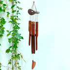 Brown bamboo wind chime with a coconut shell top and bamboo tubes