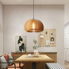 Handcrafted brown wood pendant light with soft curves
