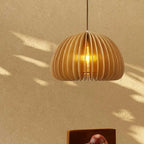 Handcrafted brown wood pendant light with soft curves