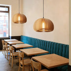 Handcrafted brown wood pendant light with soft curves