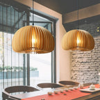 Handcrafted brown wood pendant light with soft curves