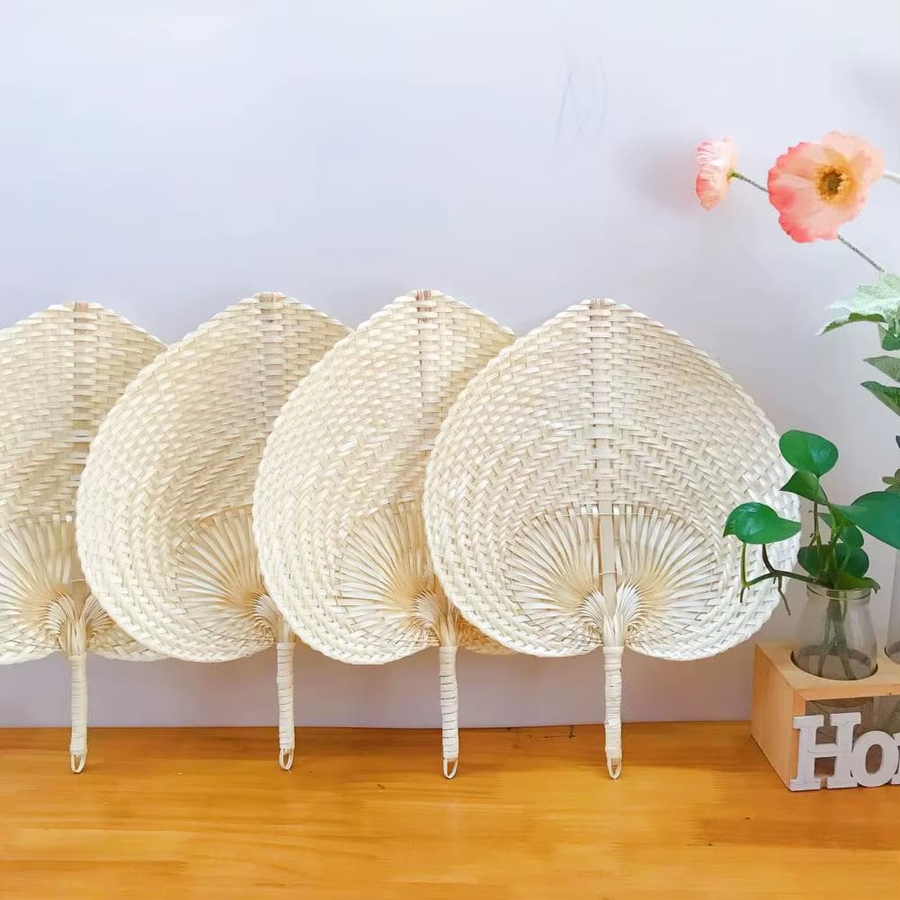 Cream heart shaped handwoven fan with a slim bamboo handle