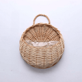 Half round rattan wall basket with a hanging loop