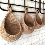 Teardrop woven wall baskets hanging on kitchen hooks
