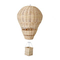 Hand woven rattan hot air balloon with a small basket hanging from the ceiling
