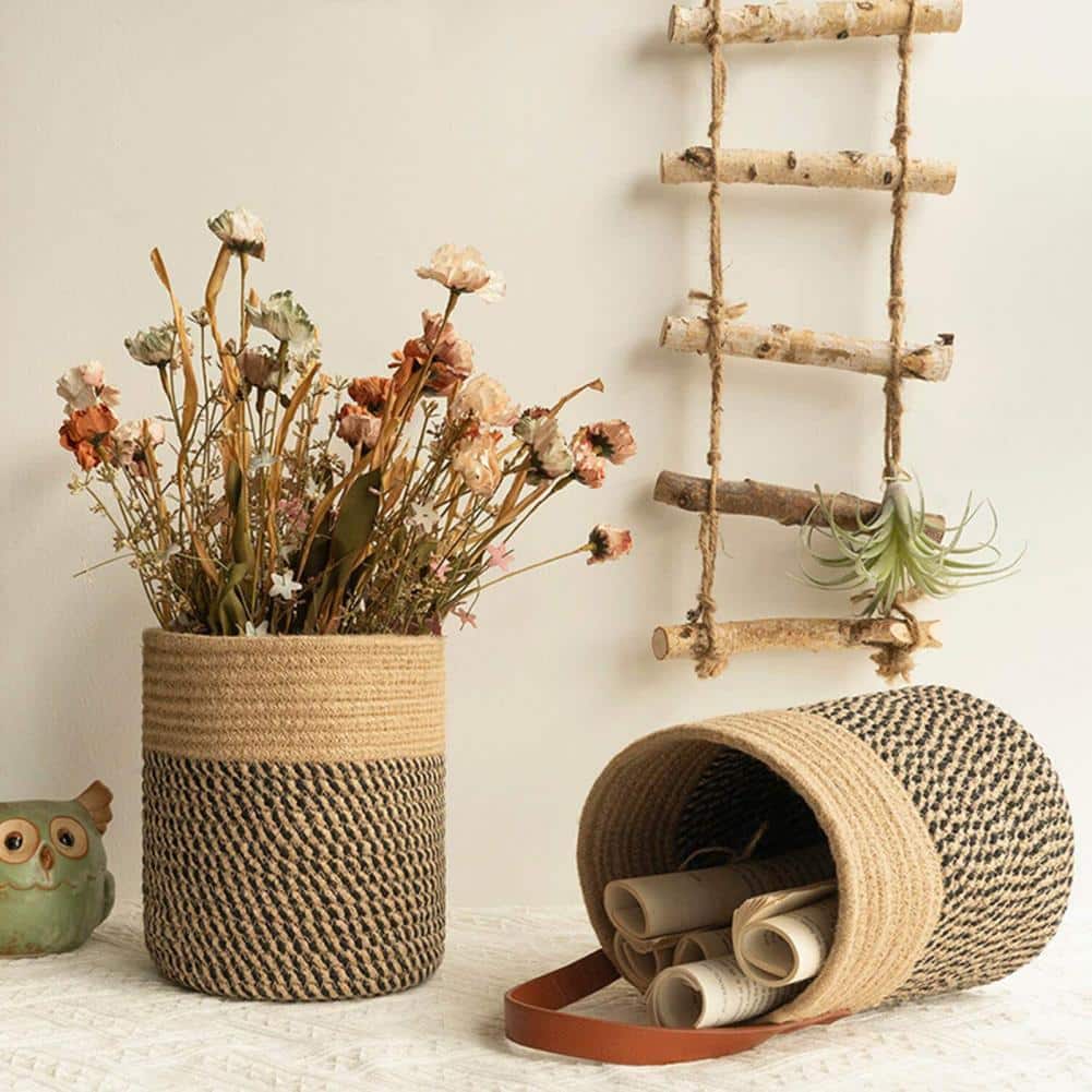 Round brown woven hanging basket with a leather strap