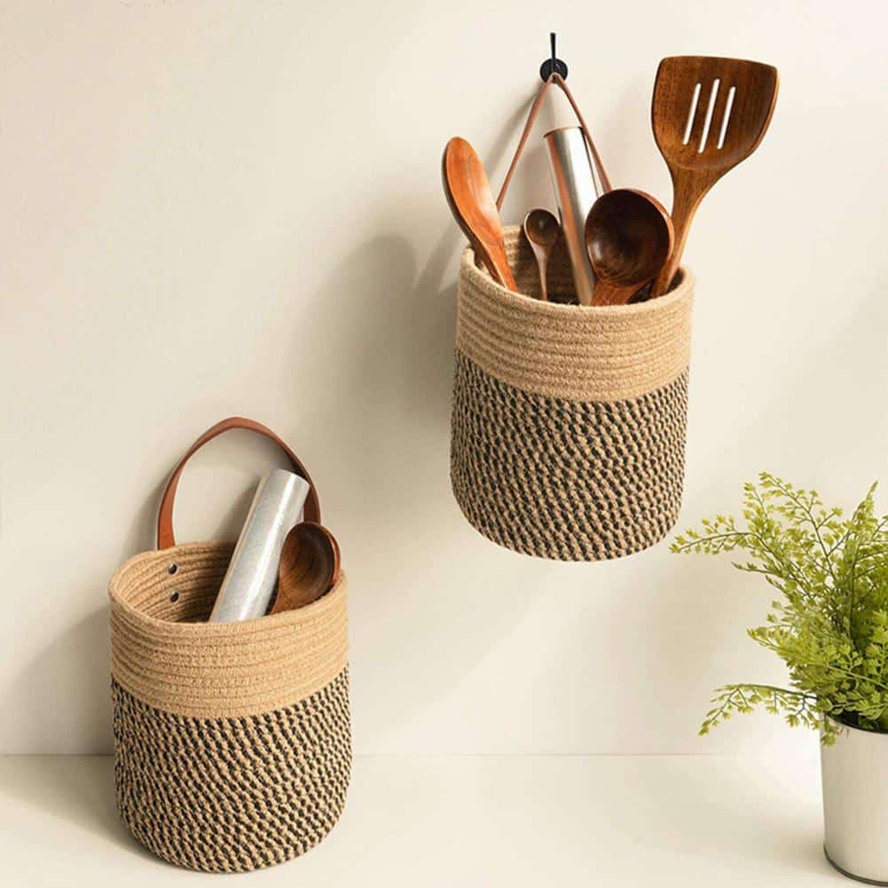 Round brown woven hanging basket with a leather strap