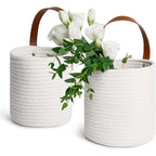 Round white woven hanging basket with a leather strap