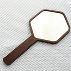 Hexagonal hand mirror with dark oak frame and long handle