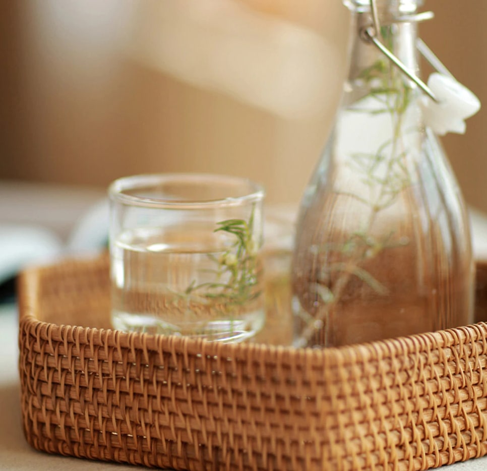 Hexagonal woven rattan tray holding apples