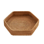 Hexagonal woven rattan tray holding apples
