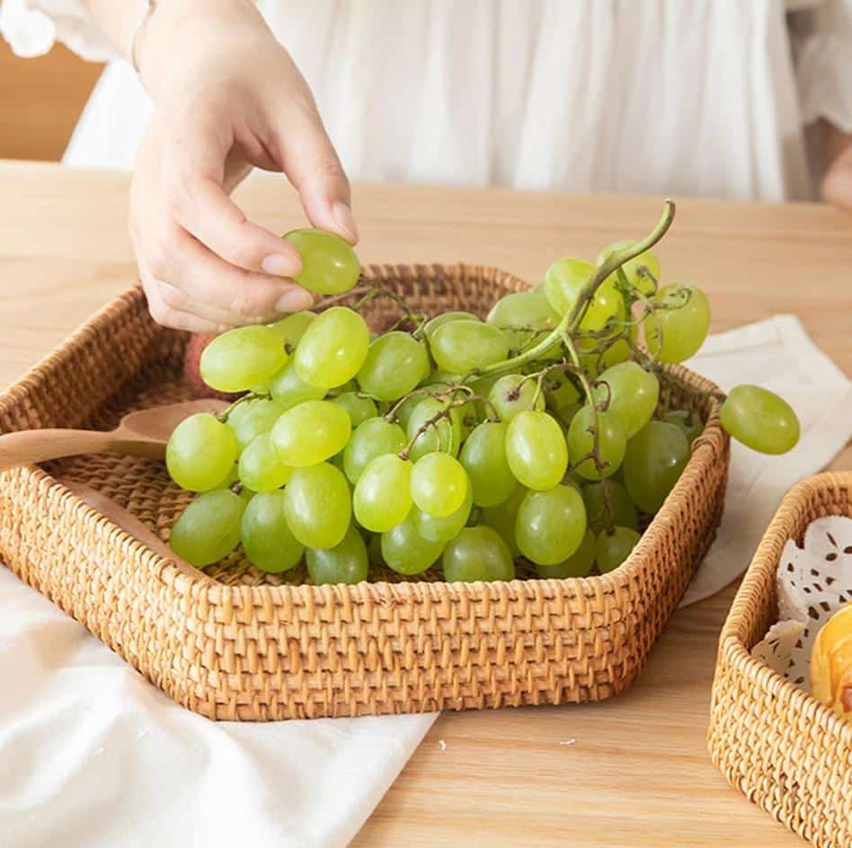 Hexagonal woven rattan tray holding apples