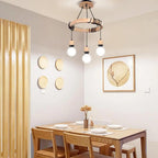 Industrial chandelier with three natural wood arms and raw metal sockets