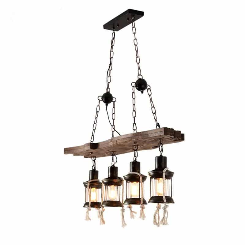 Industrial pendant light with a natural wood branch and four geometric black metal lanterns