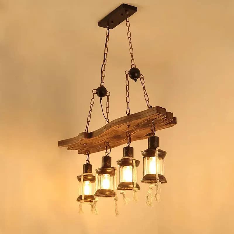 Industrial pendant light with a natural wood branch and four geometric black metal lanterns
